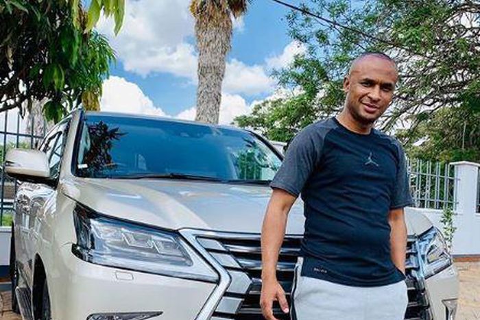 Businessman Zaheer Jhanda photographed next to his vehicle