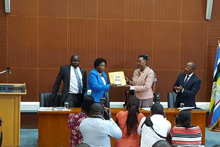 UNEB Chairperson Prof Mary Okwakol hands over the 2018 UCE Examination results to Minister of Education and sports Janet Museveni