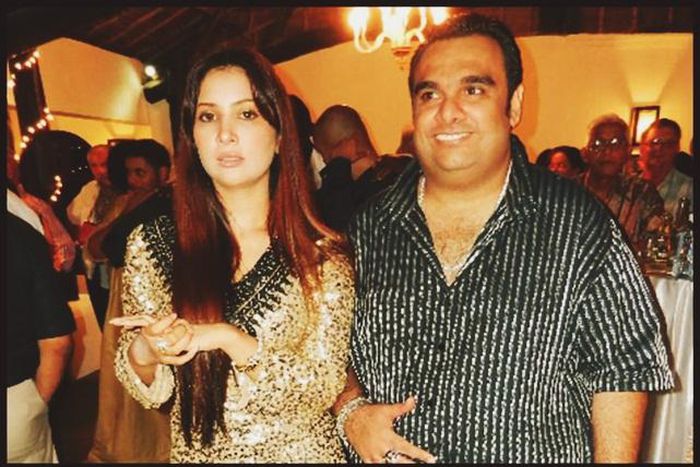 Ali Punjani (Right) in a stripped shirt