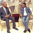 Ababu Namwamba trolled after dressing like “Awilo Longomba” for South Africa trip