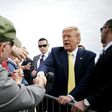 Trump Campaign Postpones Bus Tour as He Plays Down Risks of Coronavirus