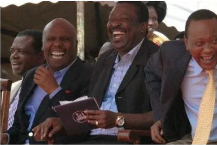 File image of Gideon Moi, Musalia Mudavadi and President Uhuru Kenyatta laughing
