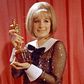 Pop star plays a performer and wins an Oscar? It's happened before