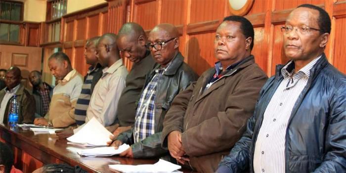 File image of NYS scandal suspects in court