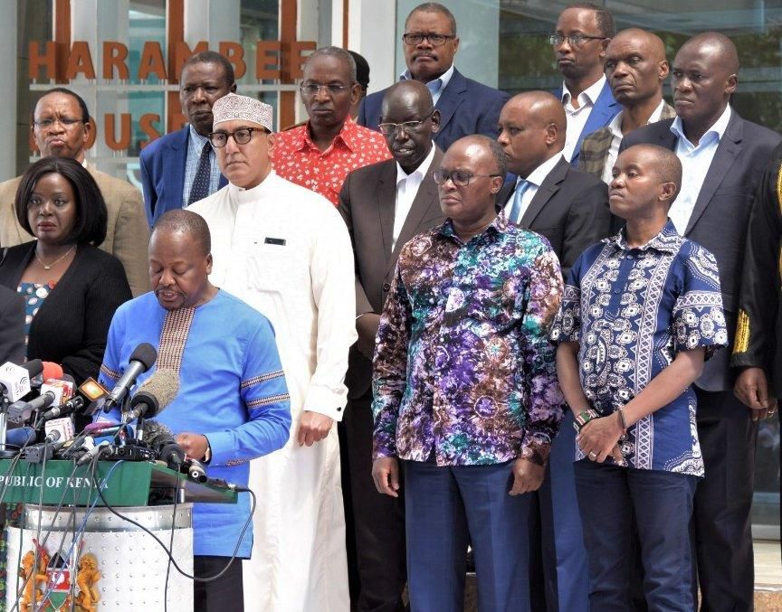 Health CS Mutahi Kagwe addressig the press flanked by other senior government officials on Friday, 13 March 2020