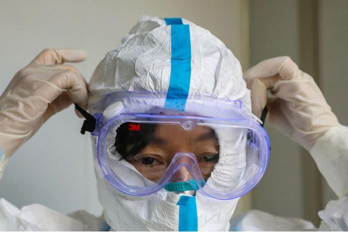 File image of a person wearing a protective facemask