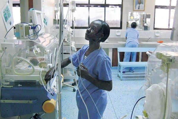 A nurse attends to babies