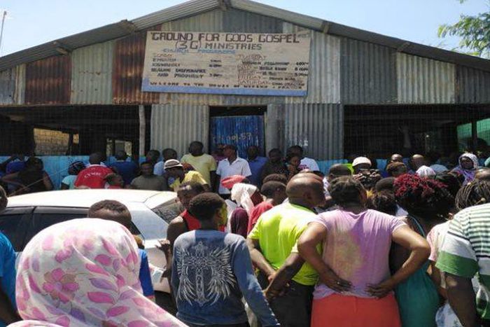 A crowd at the scene where pastor Elijah Misiko of Ground for God’s Gospel 3G Ministries in Mombasa stabbed his wife before committing suicide