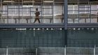 Crowded Plaza, Anxious Migrants and a Bolstered Wall