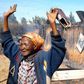 The widely shared photo of Elizabeth Wangui standing at the scene where 50 people were burnt to death at Kiambaa KAG Church