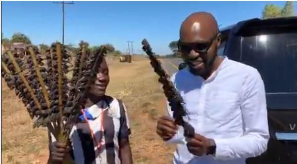 Larry Madowo eating Mouse