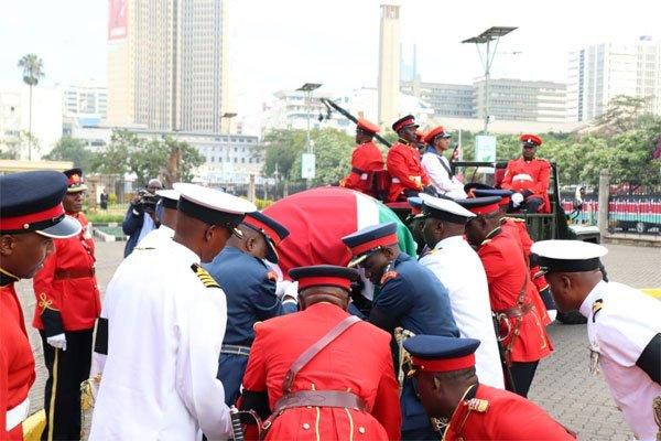 The body of retired President Danial Moi is removed from a gun carriage on February 9, 2020 for the second day of public viewing at Parliament Buildings