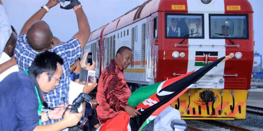 President Uhuru Kenyatta flags off one of the SGR trains during the launch of the cargo service on May 30