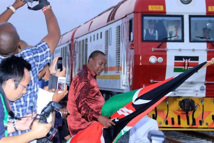 President Uhuru Kenyatta flags off one of the SGR trains during the launch of the cargo service on May 30