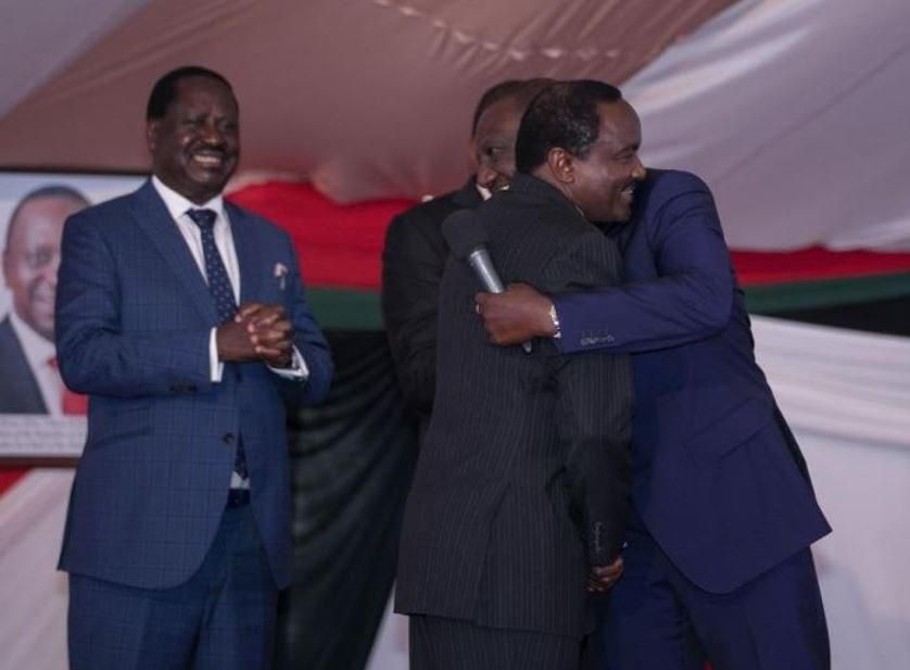 DP William Ruto and Wiper party leader Kalonzo Musyoka embrace during their version of the peace handshake