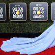 What color is Lady Gaga's dress at the Golden Globes?