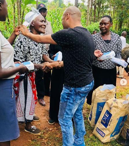 Businessman Zaheer Jhanda giving away flour