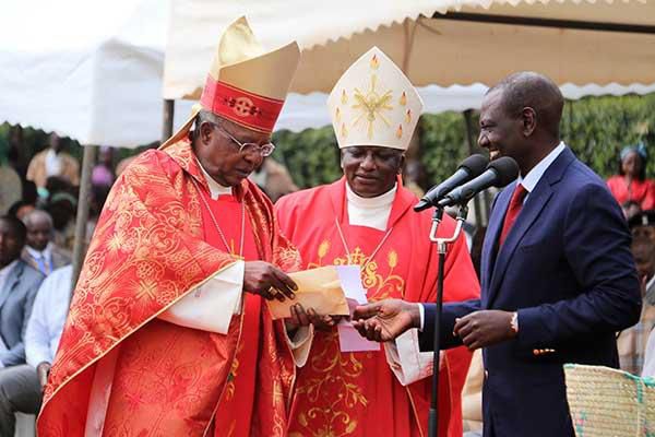 File image of DP William Ruto, John Cardinal Njue (left) during a fundraiser at a Catholic Church
