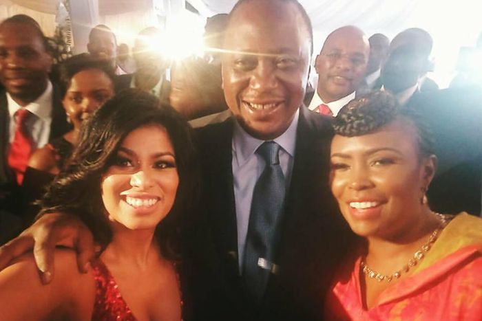 President Uhuru Kenyatta poses for a selfie with media personalities Caroline Mutoko (right) and Julie Gichuru.