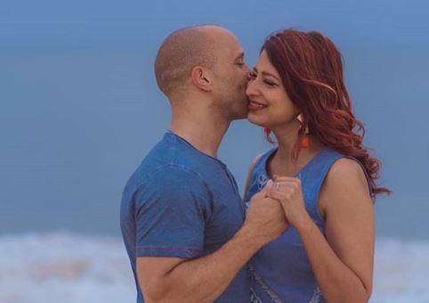 Eve D'Souza surprises her with romantic engagement on the beach in India [Photos]
