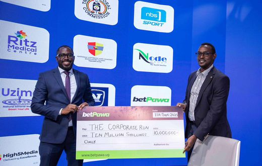 Presenting the cheque at the press conference was betPawa’s license partner, Allan Tumushabe.