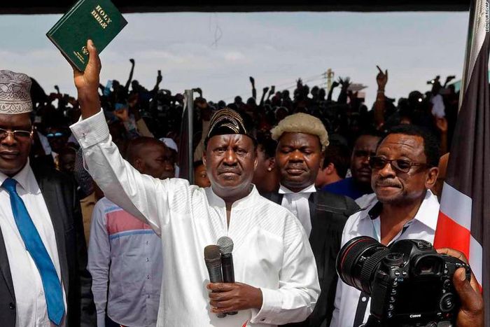 Miguna Miguna, Raila Odinga and TJ Kajwang at the mock swearing in ceremony at Uhuru Park