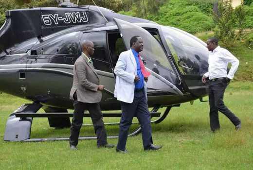 Kenya's former Prime Minister, Raila Odinga, embarks from a chopper at a a past event. (SDE).
