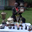 Athletics legend Benjamin Jipcho Chemaima showcasing some of his awards during a past media interview