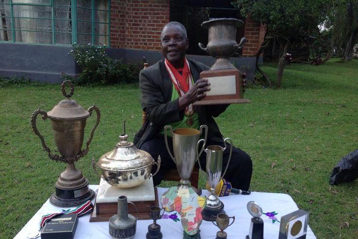 Athletics legend Benjamin Jipcho Chemaima showcasing some of his awards during a past media interview