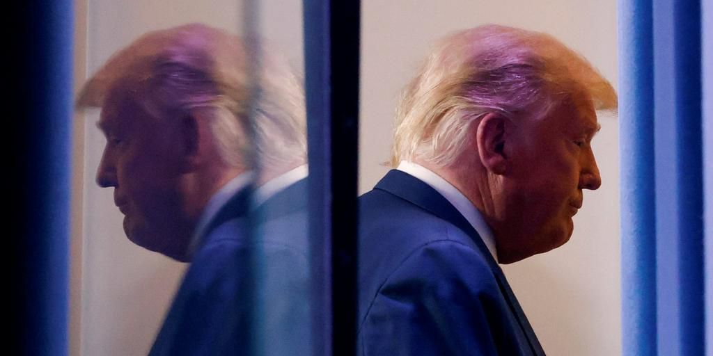 President Donald Trump is reflected as he departs after speaking about the 2020 US presidential election results in the Brady Press Briefing Room at the White House on November 5, 2020.