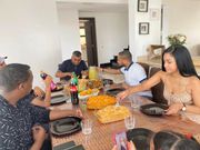 Tanasha Donna shares a meal with Jamal Gaddafi and other team members