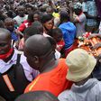 Mourner with Bernard Onyango aka Abenny Jachiga Coffin