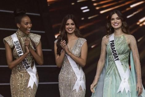The final three Miss Universe contestants (L to R) Miss South Africa Lalela Mswane; Miss India Harnaaz Sandhu and Miss Paraguay Nadia Ferreira pose on stage during the 70th Miss Universe beauty pageant in Israel’s southern Re