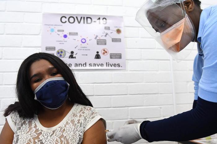 A volunteer receives an injection for a potential vaccine against COVID-19 in South Africa.