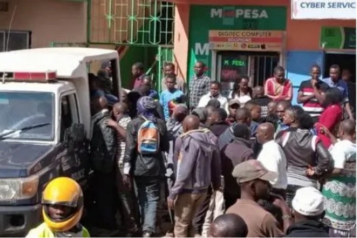 File image of a crowd at a crime scene