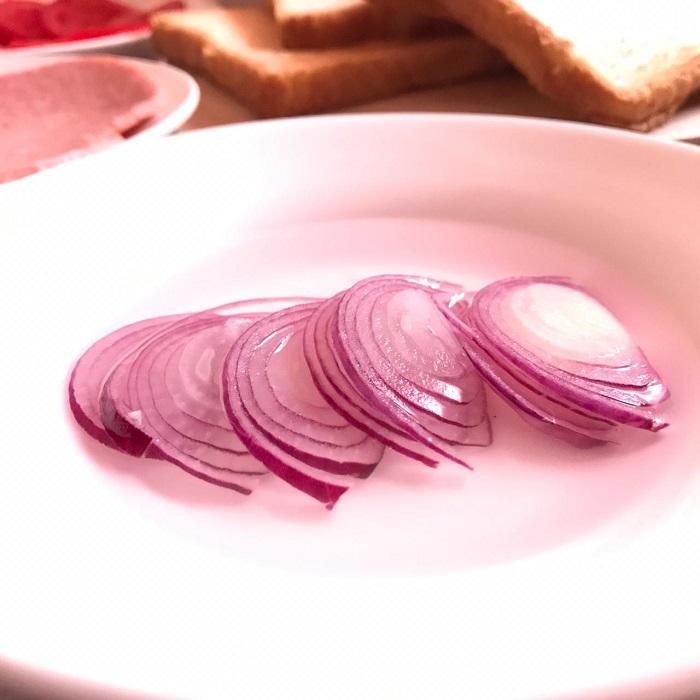 Avoid 'onion breath' by steeping onions in hot salty water before adding them to the sandwich