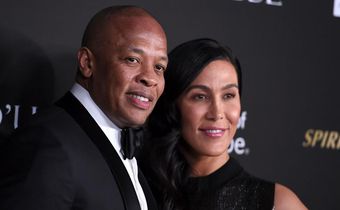 Dr Dre, left, pictured with Nicole Young in 2018