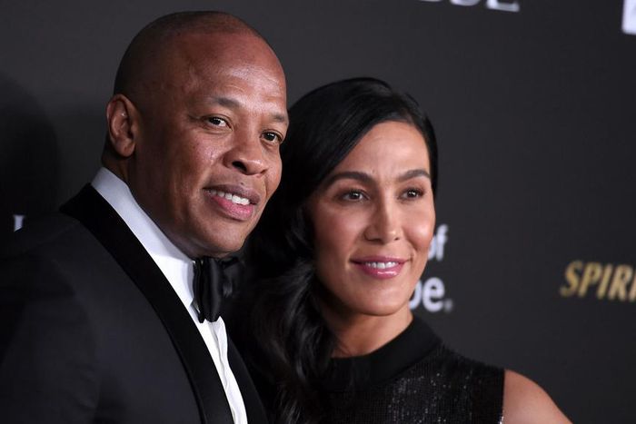 Dr Dre, left, pictured with Nicole Young in 2018