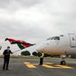 Transport CS James Macharia flags off a Kenya Airways plane during the resumption of local flights