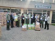 Roselyn Linguli, representative of U.S. Embassy INL office, presents PPE to Kenya Prison Services, represented by Assistant Commissioner of Prisons Florence Omundi