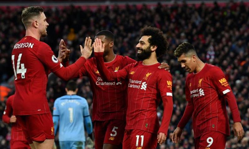 22 reasons to cheer: Mohamed Salah (2nd right) and Jordan Henderson (left) scored in Liverpool's victory over Southampton