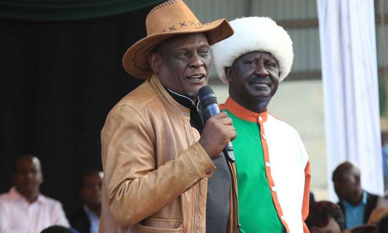 File image of David Murathe with Raila Odinga