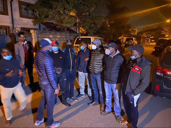 Senators outside Senator Langat's home