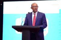 Ecobank Board Chairman Richard Munyaneza addressing the customers at the event.