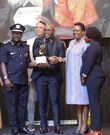 Kennedy Omondi, Principal Indomie Uganda recieveing the award from the Minister Hon. Betty Amongi, Minister of Gender, Labour, and Social Development