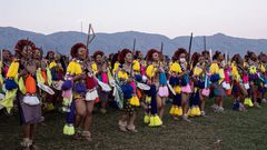 Nomcebo Zuma (3rd L) and one of the king’s daughters, Princess Sakhizwe (2nd L), sing and dance with other young women during the Umhlanga reed dance. Photograph: Emmanuel Croset/AFP/Getty Images