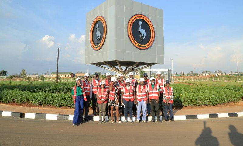 EfD-Mak Team and Inclusive Green Economy (IGE) Fellows pose for a group photo at the Kiira Motors Corporation (KMC) plant in Jinja