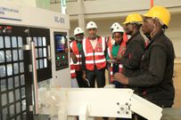The team views the Circular Saw in action