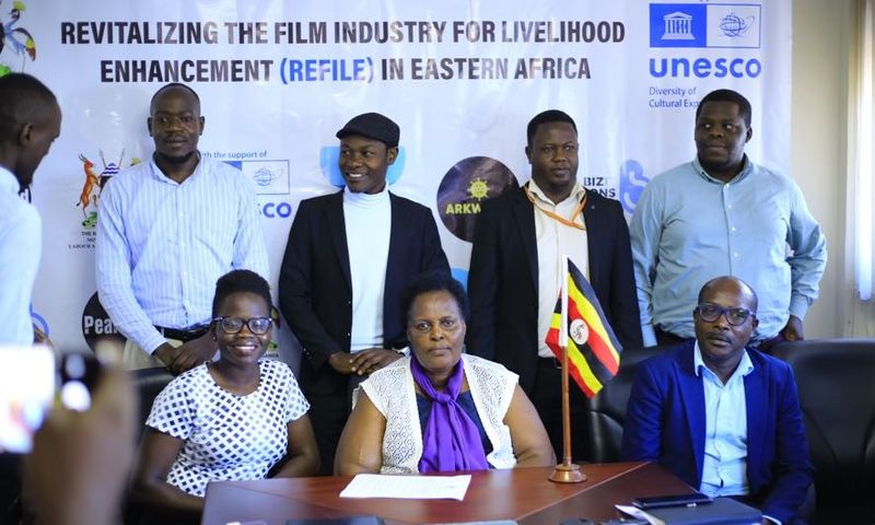 Dr. Ruth Tusasirwe Muguta, Principal Social Development Officer at the Ministry with some of the players in the film industry  addressing press on Thursday