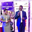 Hon Daudi Migereko giving a speech after recieving his award as a trend setter for his work in setting up FINCA Uganda